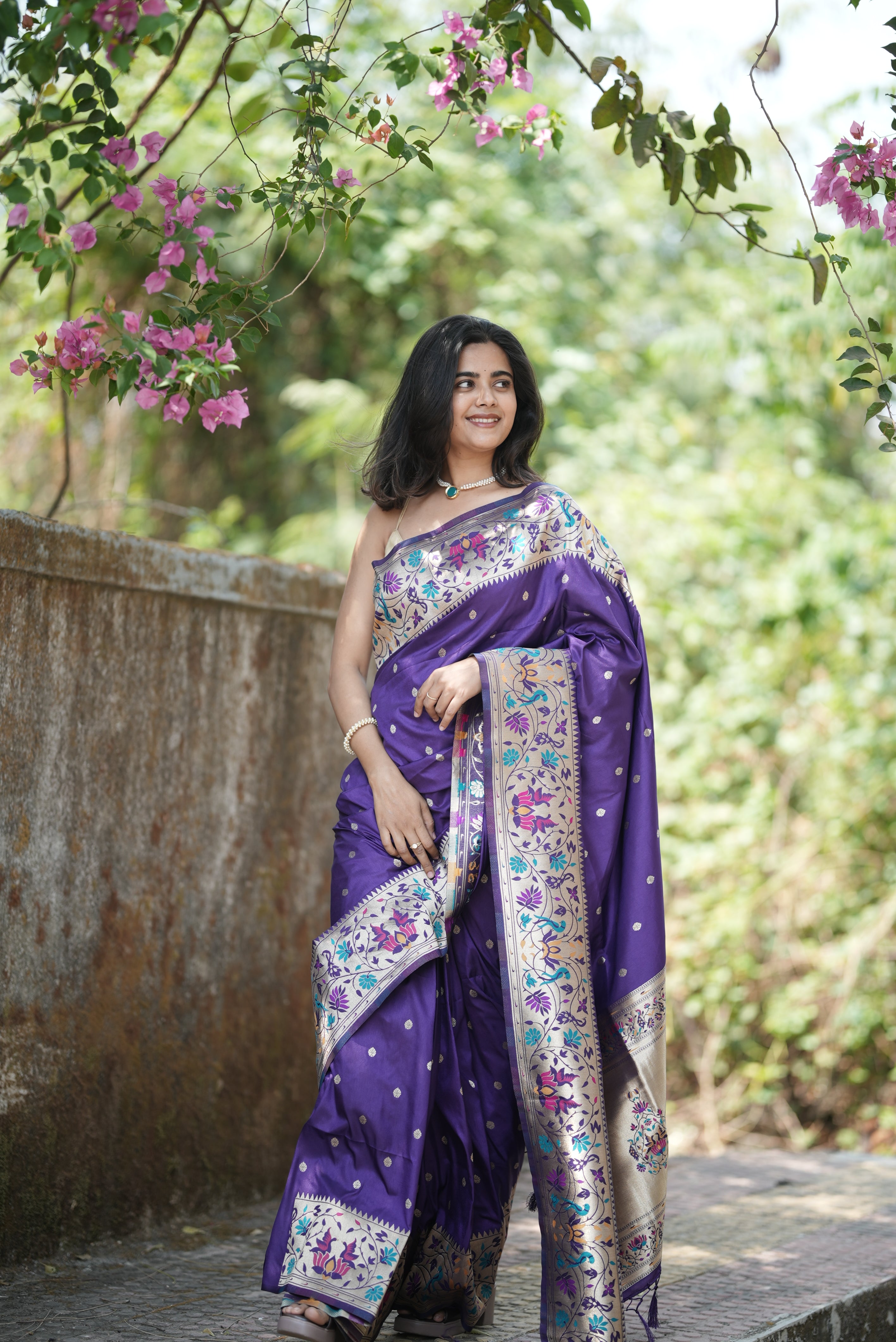Royal purple Paithani saree with elegant zari buttas and a rich floral border