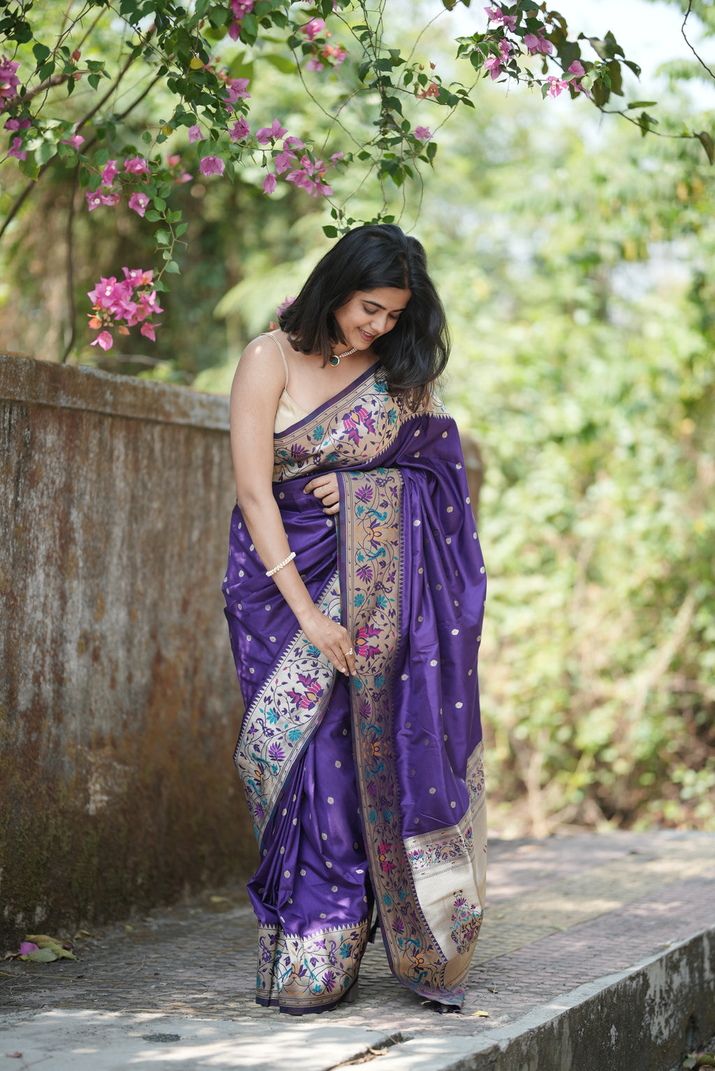 Royal purple Paithani saree with elegant zari buttas and a rich floral border