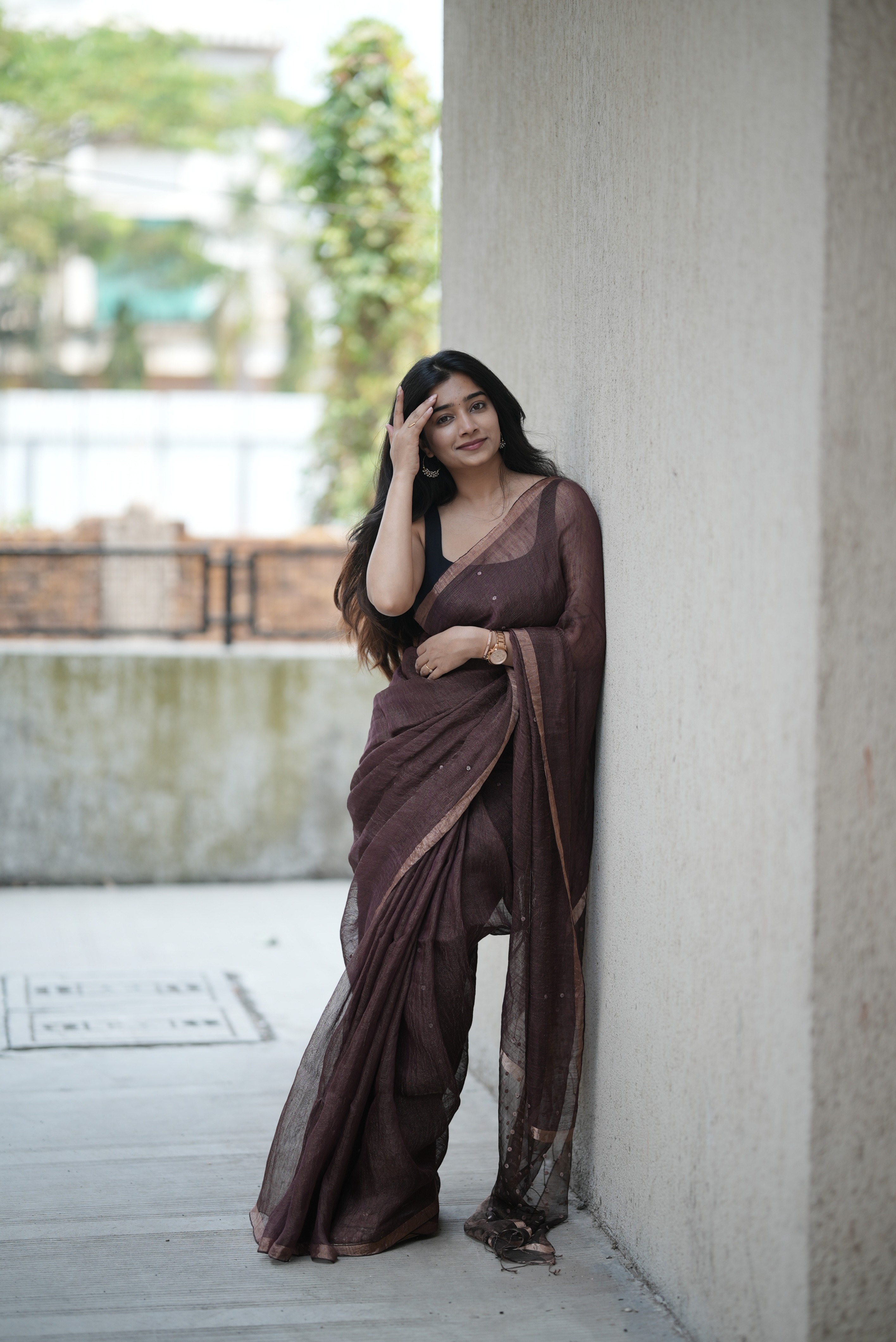 Rich chocolate brown Masline silk saree with subtle sequins—sheer elegance for a classy, modern look