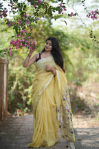 Lemon yellow silk linen Paithani featuring a classic temple border, elegant circular buttas, and a beautifully detailed peacock pallu
