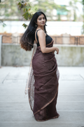 Rich chocolate brown Masline silk saree with subtle sequins—sheer elegance for a classy, modern look