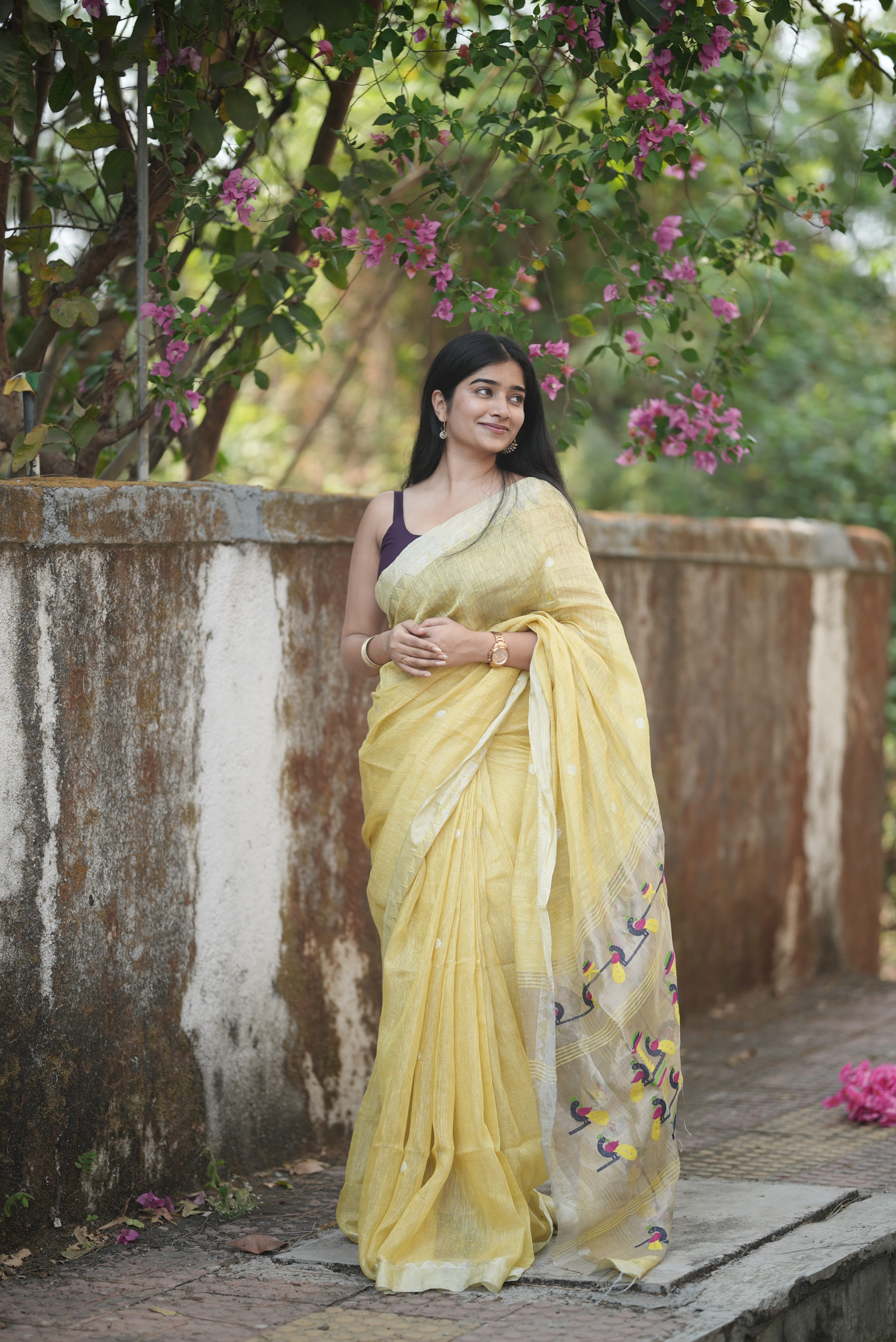 Lemon yellow silk linen Paithani featuring a classic temple border, elegant circular buttas, and a beautifully detailed peacock pallu