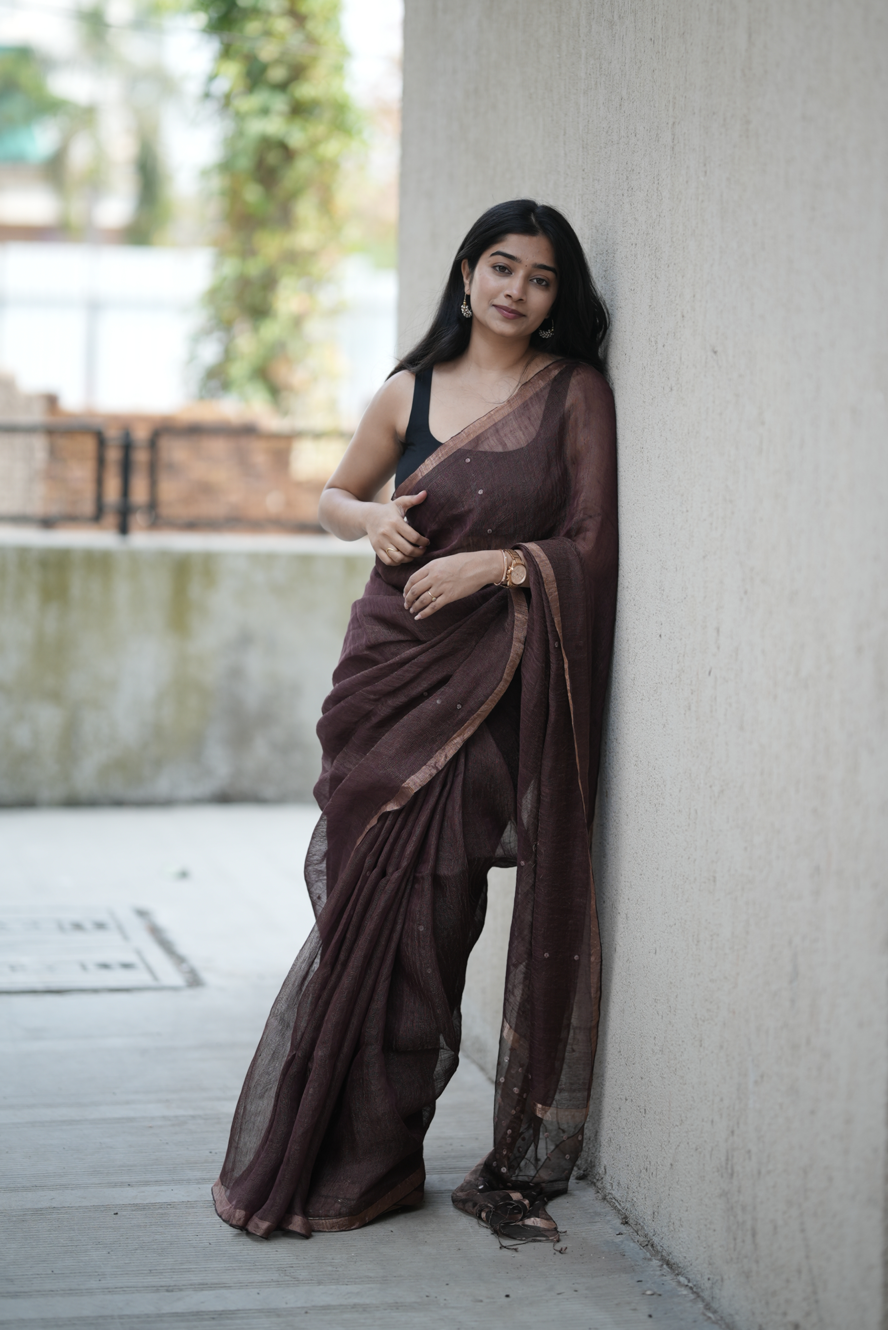 Rich chocolate brown Masline silk saree with subtle sequins—sheer elegance for a classy, modern look