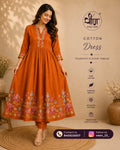 Orange cotton dress is adorned with delicate floral embroidery, adding a touch of charm and grace to your everyday style.