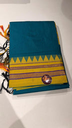 Grace meets everyday comfort with this elegant Cotton Temple Border Saree. Featuring a soothing  body paired with a rich  temple border accented with fine golden zari detailing