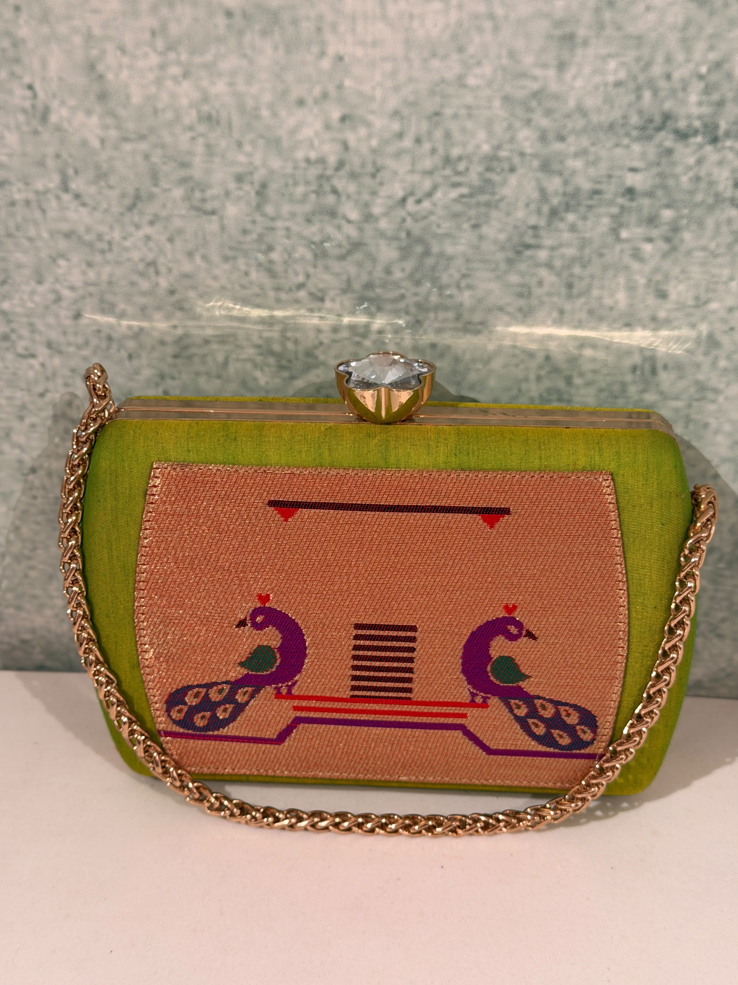 Tradition in every weave, elegance in every detail. This handcrafted Paithani clutch is the perfect festive companion.