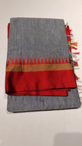 Grace meets everyday comfort with this elegant Cotton Temple Border Saree. Featuring a soothing  body paired with a rich  temple border accented with fine golden zari detailing.