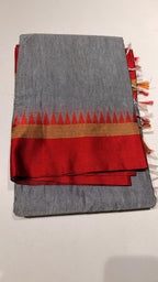 Grace meets everyday comfort with this elegant Cotton Temple Border Saree. Featuring a soothing  body paired with a rich  temple border accented with fine golden zari detailing.