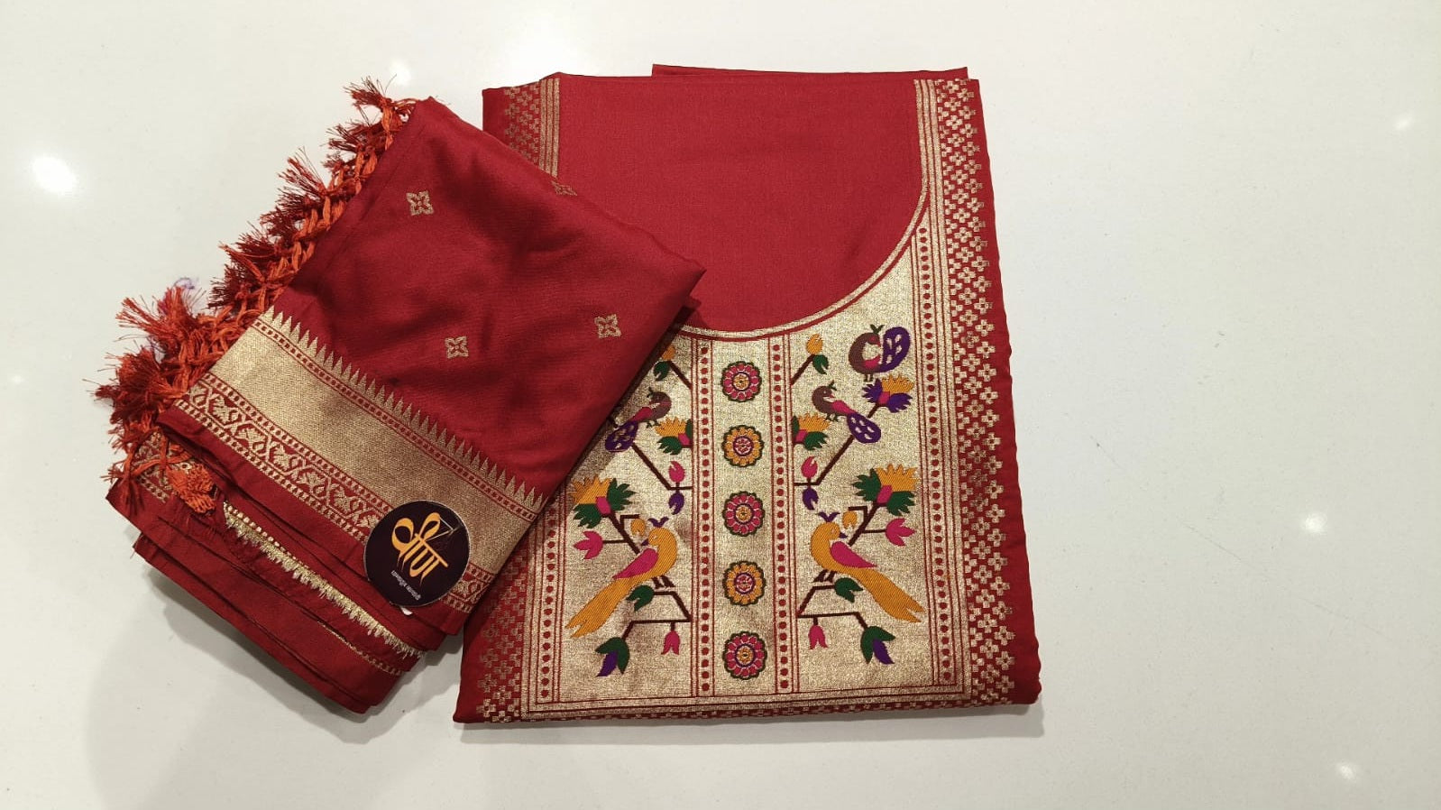 Rich Paithani weaving, vibrant peacock motifs, and royal charm—all in one beautiful dress material. ❤️